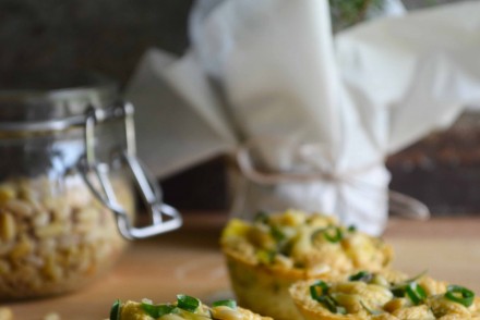 A photo of healthy egg muffins with rosemary, pine nuts and veggies. Recipe and photo by That Healthy Kitchen