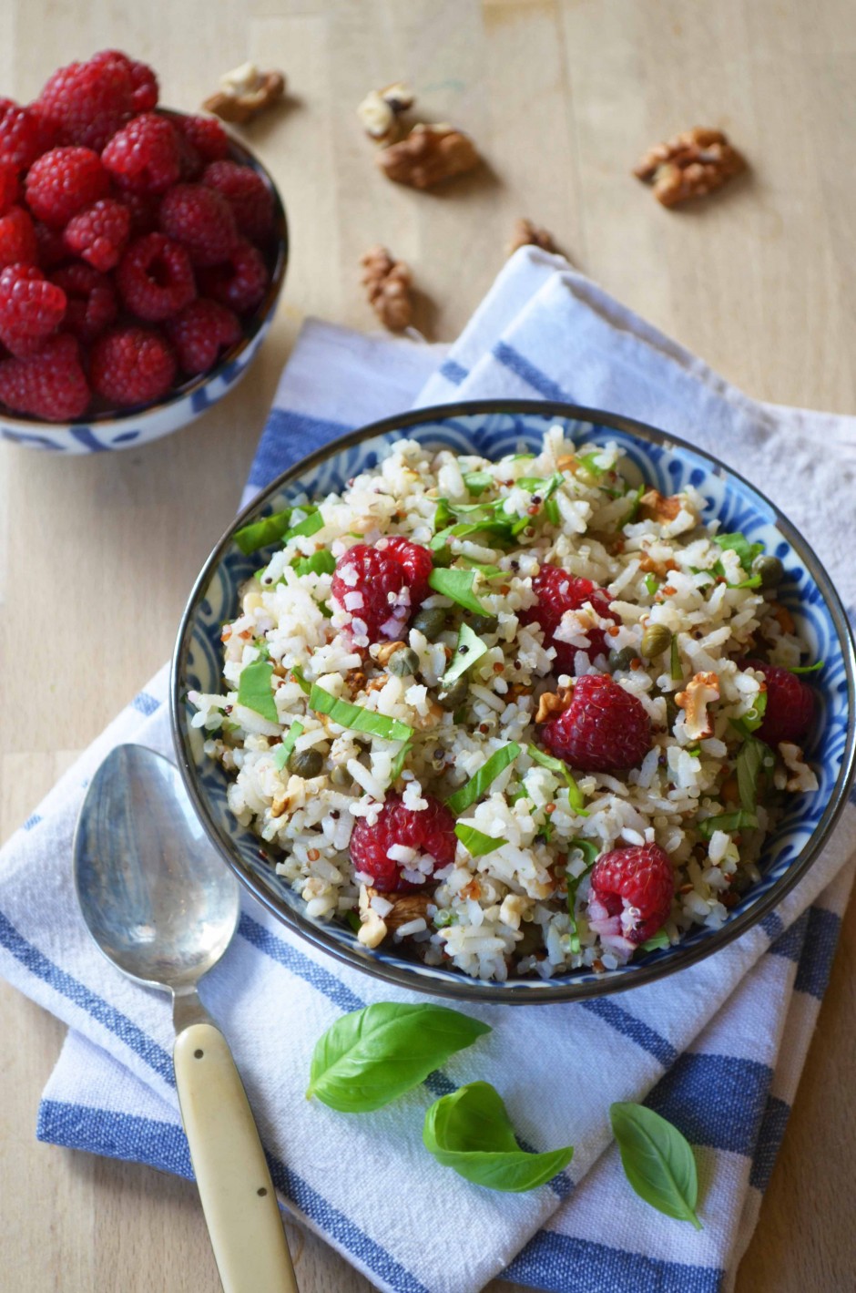 Bowl of grain salad with raspbberries, basil and walnuts. Recipe and photo by That Healthy Kitchen