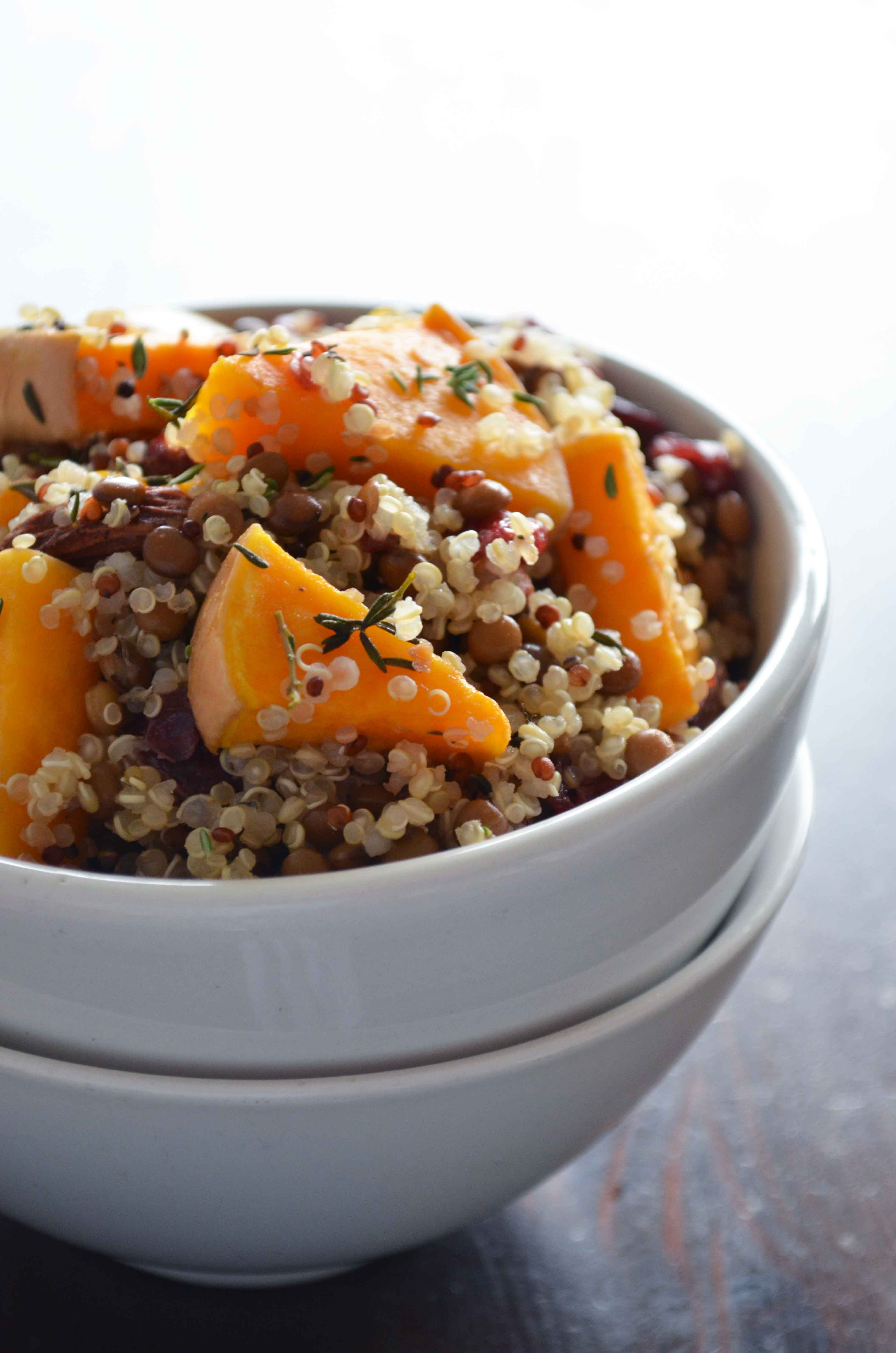 Recipe for Winter Quinoa Salad with thyme roasted butternut squash, almonds, quinoa, lentils, cranberries and a tangy orange vinaigrette. It is basically heaven in a bowl! {vegan, gluten free, paleo}