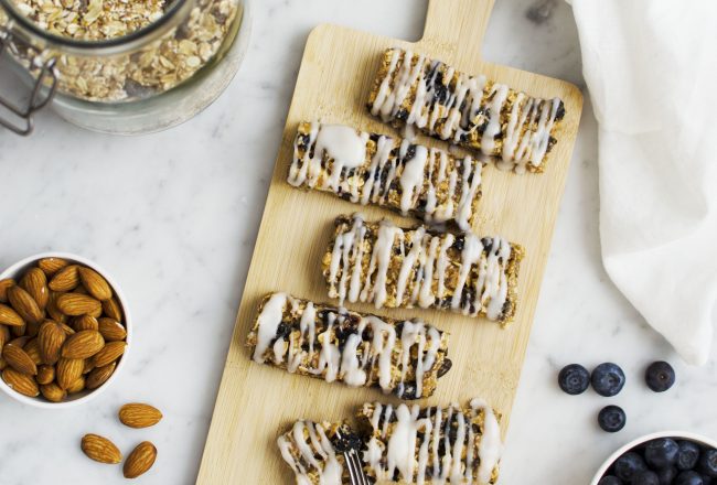 Soft and chewy blueberry granola bars with almond butter and a (vegan) yoghurt coating. These are better than the store bought ones for sure!! Recipe via That Healthy Kitchen